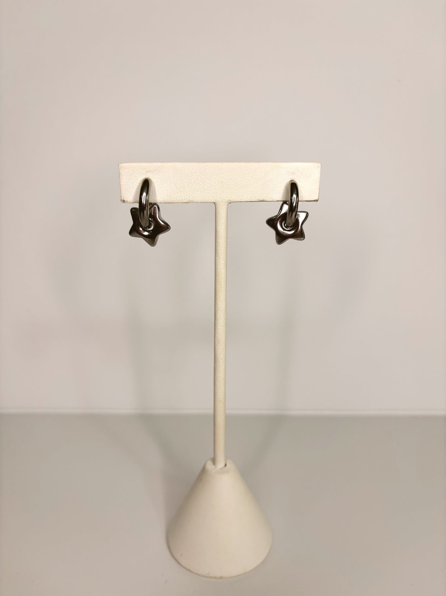 Arracadas estrellas plateadas